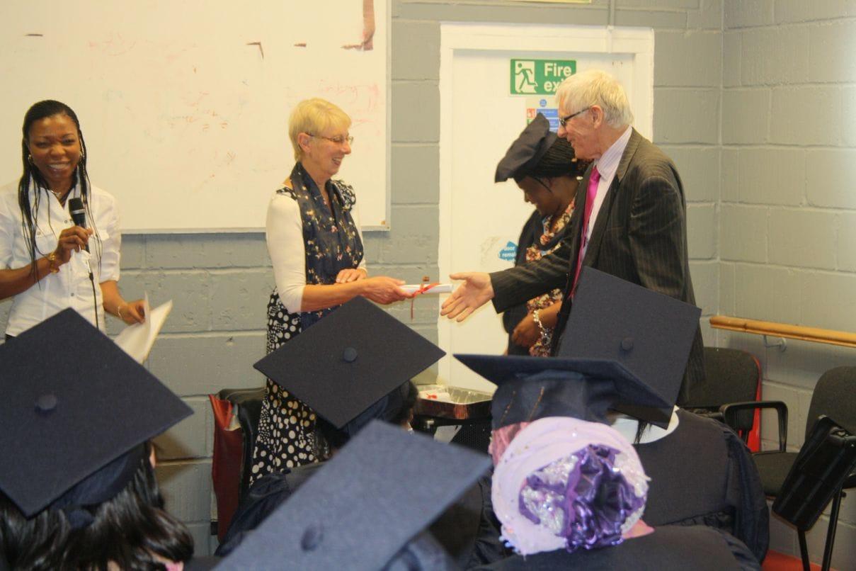 A Keyznow learner receiving a certificate at an award ceremony